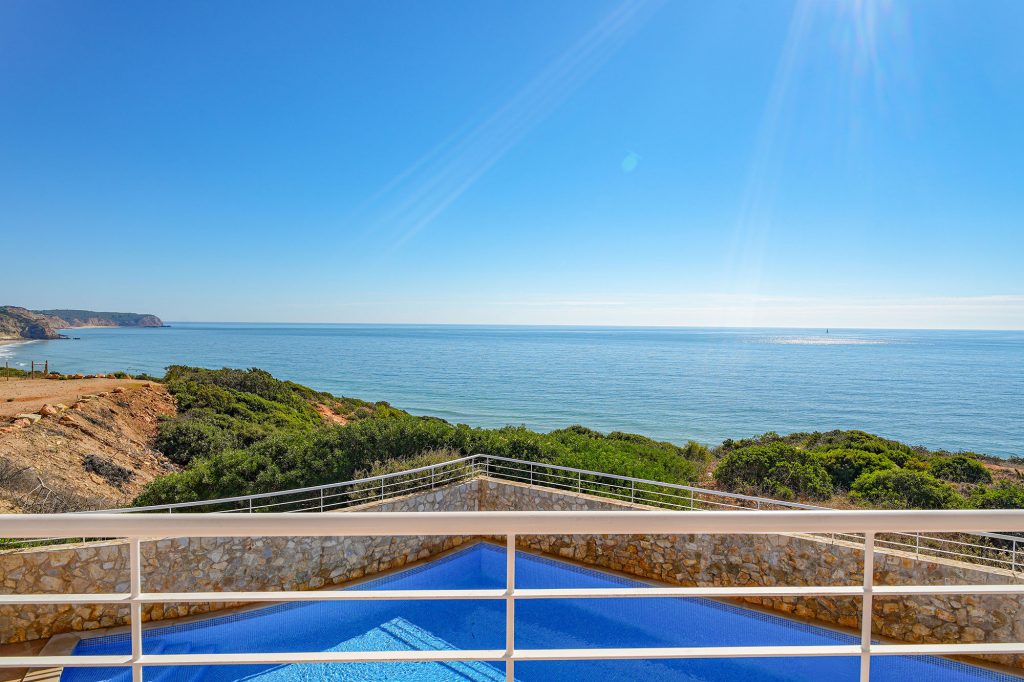 Estevas view over barrier to sea above pool